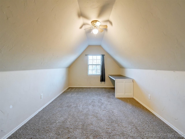 bonus room with carpet, ceiling fan, and lofted ceiling