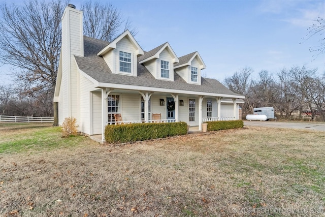 11818 N Harvard Ave, Skiatook, OK 74070 - new england style home with a porch, a chimney, a shingled roof, and a garage