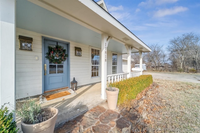 property entrance featuring covered porch