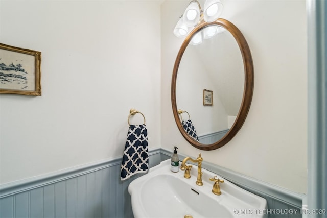 11818 N Harvard Ave, Skiatook, OK 74070 - bathroom featuring a sink and wainscoting