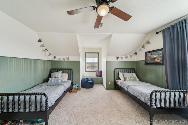 carpeted bedroom featuring ceiling fan and vaulted ceiling