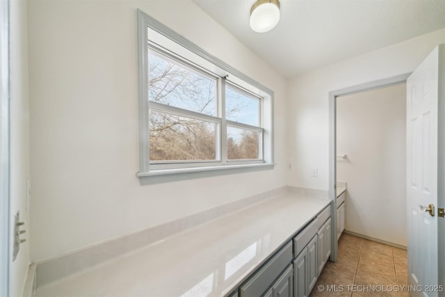 bathroom with tile patterned flooring and vanity