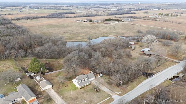 birds eye view of property featuring a water view and a rural view