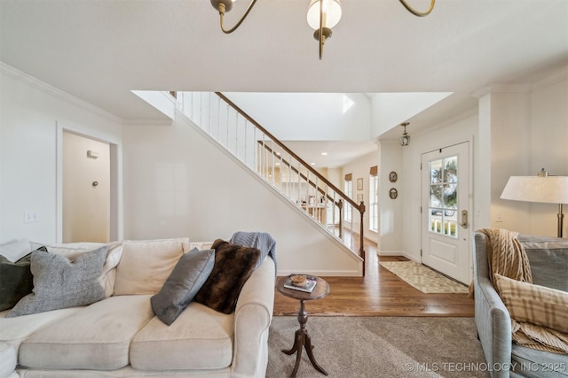 living room featuring hardwood / wood-style floors and ornamental molding