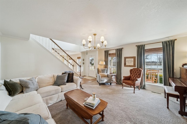 carpeted living room featuring a healthy amount of sunlight, ornamental molding, and a chandelier