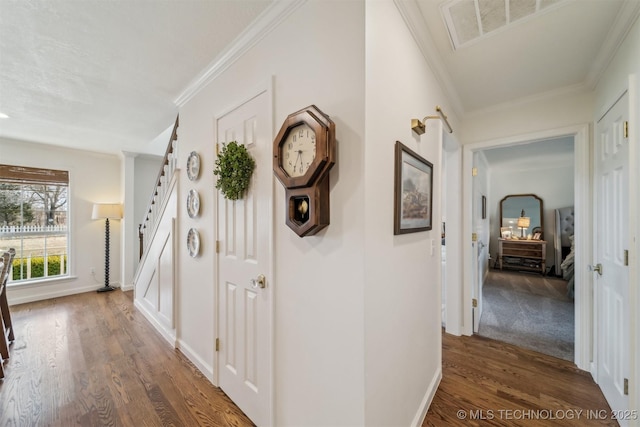 hall featuring dark hardwood / wood-style flooring and ornamental molding