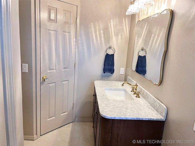 bathroom with tile patterned flooring and vanity