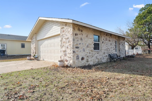 11818 N Harvard Ave, Skiatook, OK 74070 - view of side of home with stone siding, driveway, and a garage