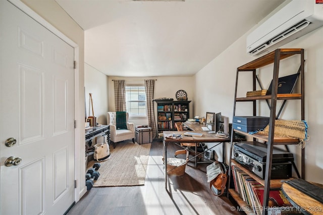 office area with hardwood / wood-style floors and a wall mounted AC