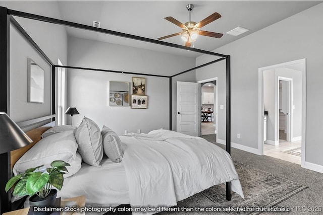 carpeted bedroom with a ceiling fan, arched walkways, visible vents, and baseboards