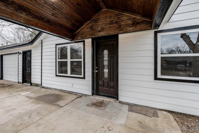 doorway to property featuring a garage