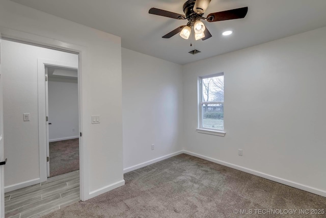 carpeted empty room with ceiling fan