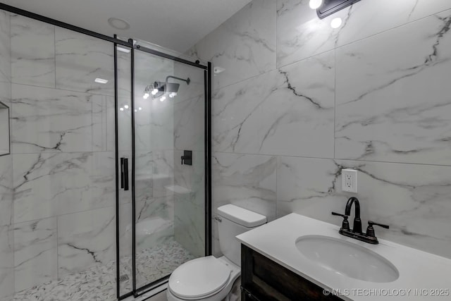 bathroom featuring vanity, an enclosed shower, and toilet