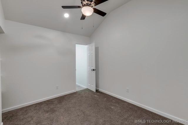 unfurnished room with ceiling fan, carpet floors, and lofted ceiling