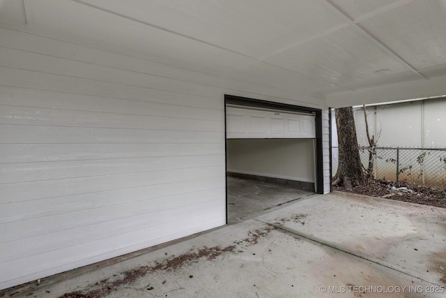 garage featuring wood walls