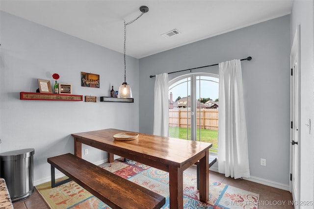 dining space with light tile patterned floors