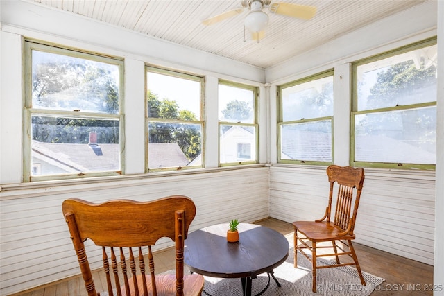 sunroom featuring ceiling fan