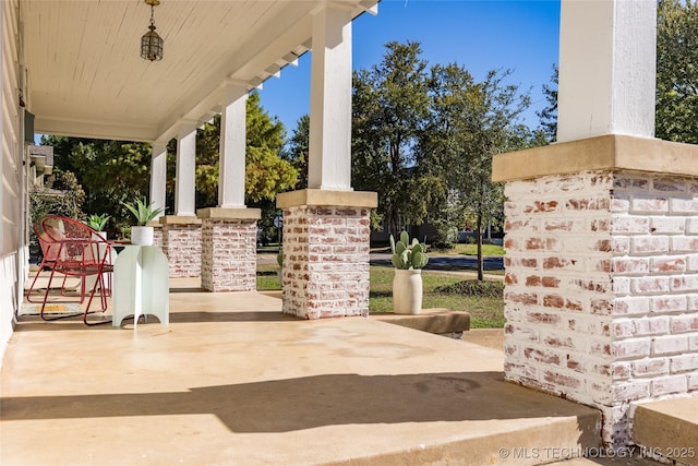 view of patio featuring a porch