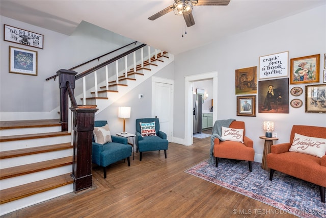 sitting room with hardwood / wood-style flooring and ceiling fan