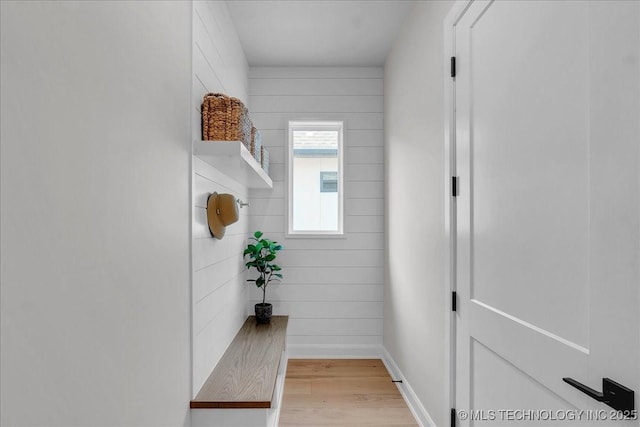 hall with light hardwood / wood-style flooring