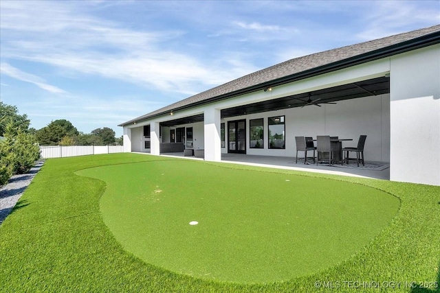 back of house with a patio and ceiling fan