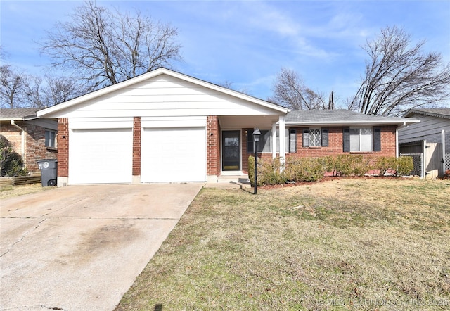 ranch-style house featuring a garage and a front lawn