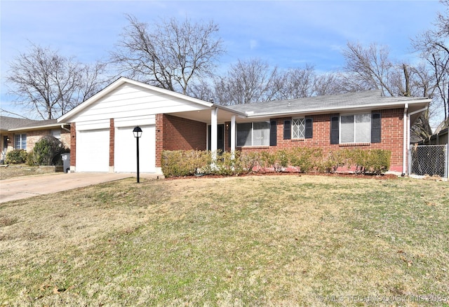 single story home featuring a garage and a front lawn