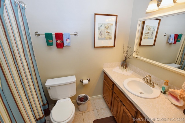 bathroom featuring tile patterned floors, vanity, and toilet