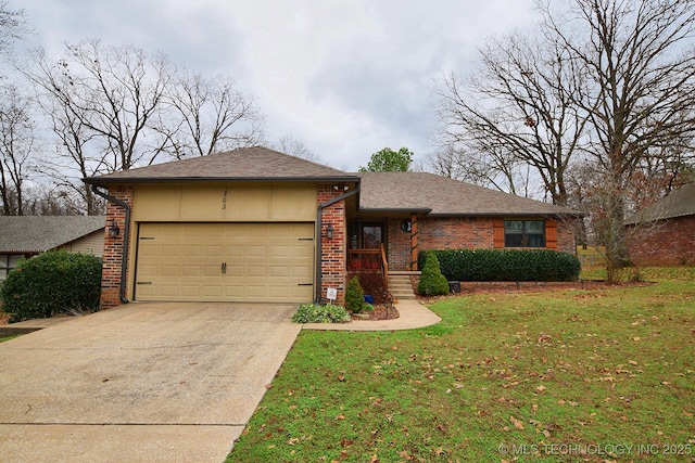 view of front of house with a front yard and a garage