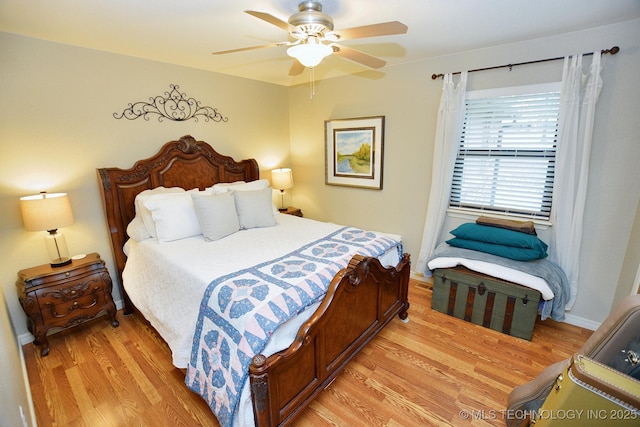 bedroom featuring light hardwood / wood-style flooring and ceiling fan