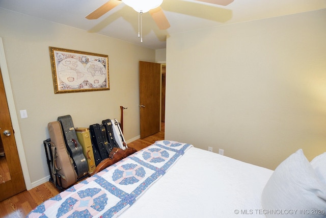 bedroom with ceiling fan and light wood-type flooring