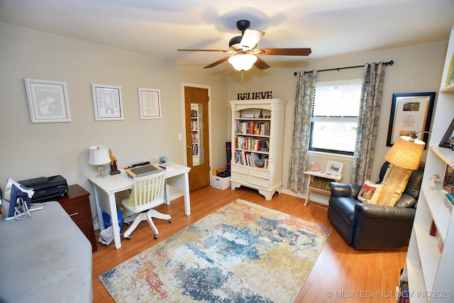 office area with hardwood / wood-style floors and ceiling fan