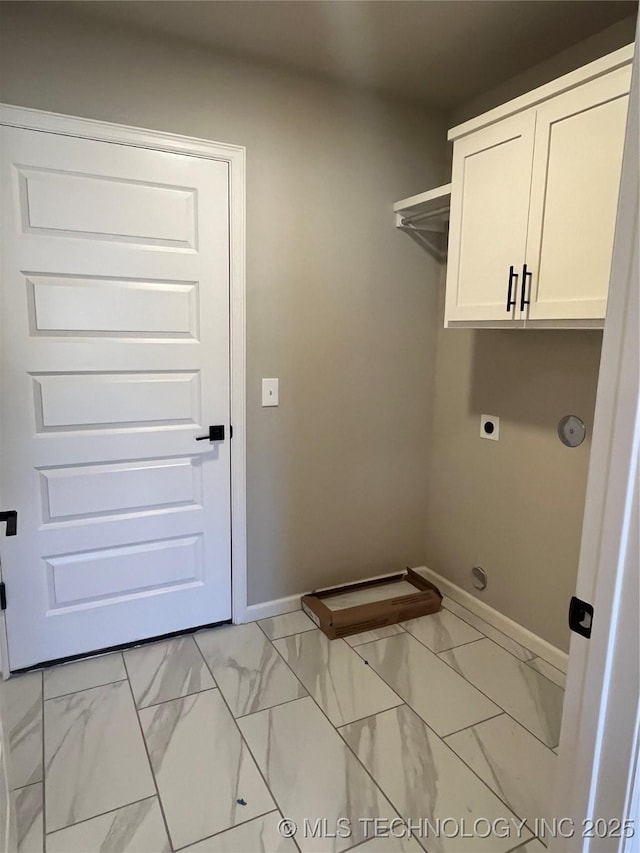 laundry area with marble finish floor, electric dryer hookup, baseboards, and cabinet space