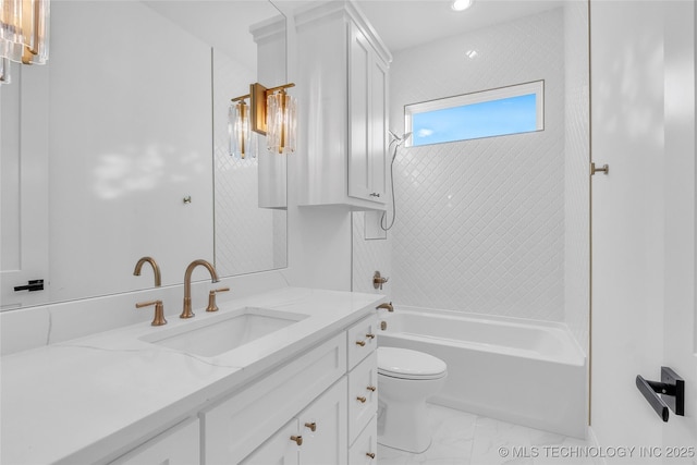 full bathroom featuring toilet, vanity, and tiled shower / bath combo