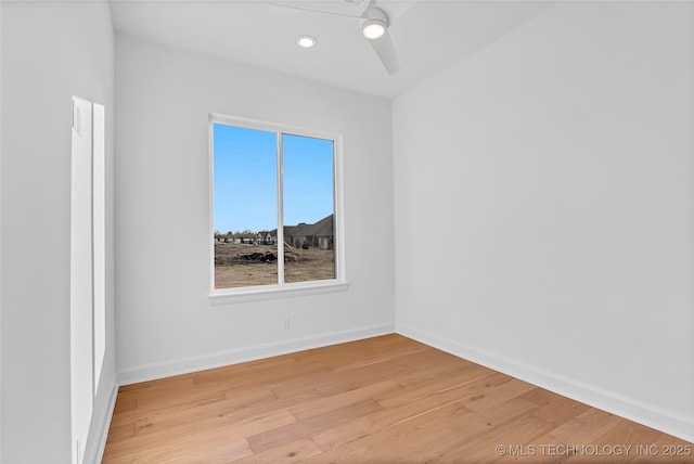 unfurnished room featuring ceiling fan and light hardwood / wood-style flooring