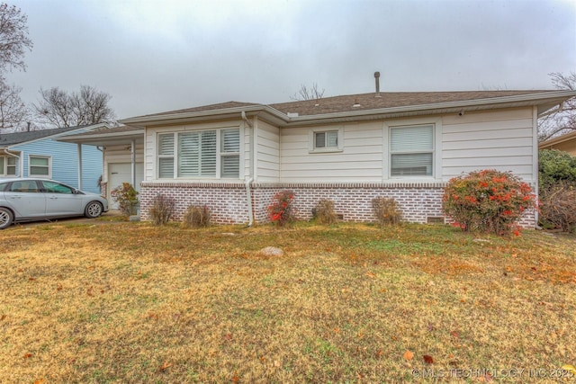 view of front facade with a garage and a front lawn