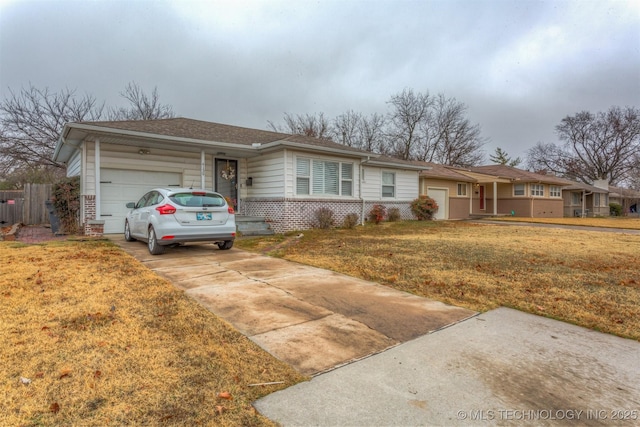 single story home with a front yard and a garage