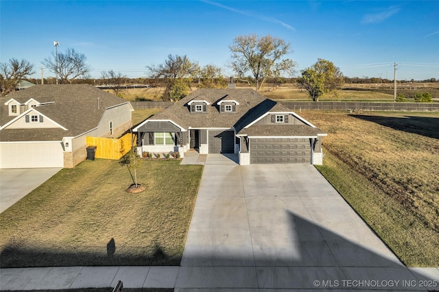 view of front facade featuring a front yard and a garage