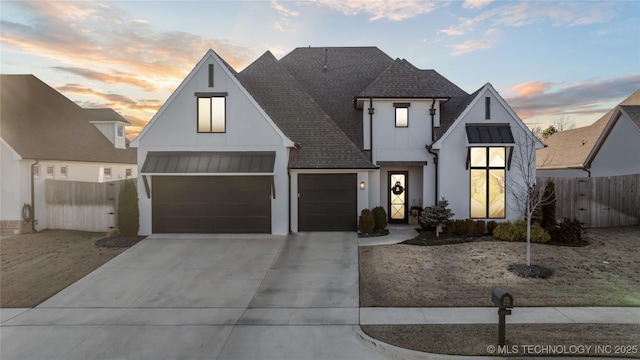 modern farmhouse featuring a garage