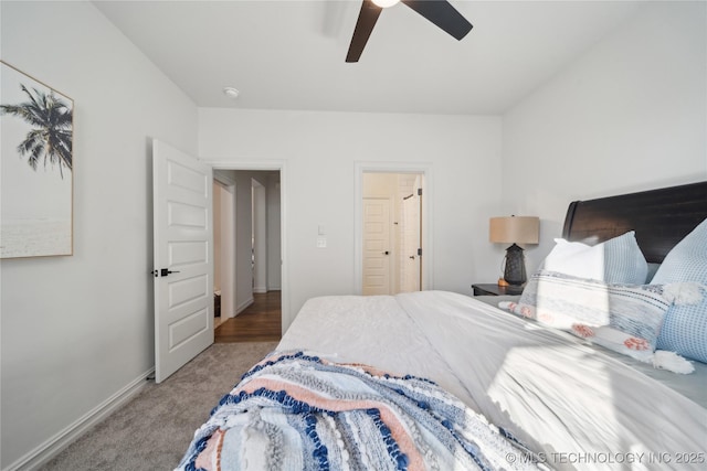 carpeted bedroom featuring ceiling fan