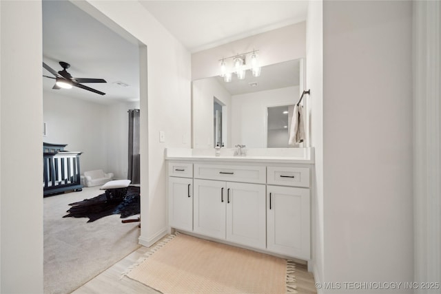 bathroom featuring ceiling fan and vanity