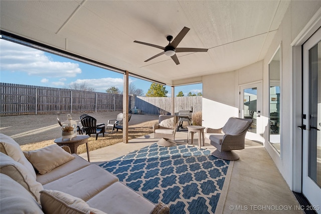 sunroom featuring ceiling fan