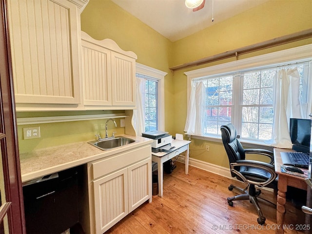 office area featuring light hardwood / wood-style flooring and sink