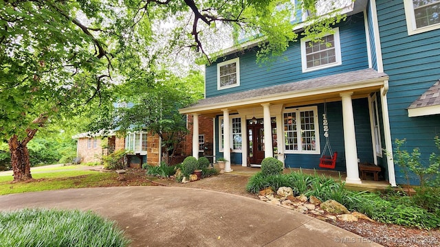 view of front of property featuring covered porch