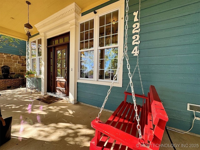 property entrance with covered porch