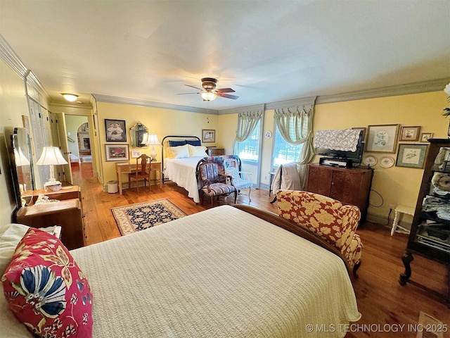 bedroom featuring wood-type flooring, ceiling fan, and ornamental molding