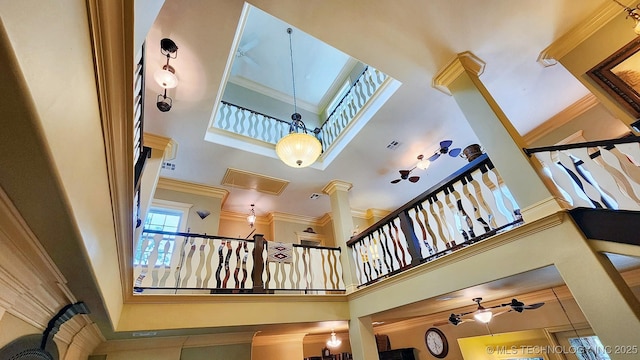 room details featuring ceiling fan and ornamental molding