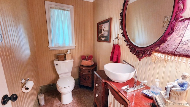 bathroom featuring tile patterned floors, vanity, and toilet