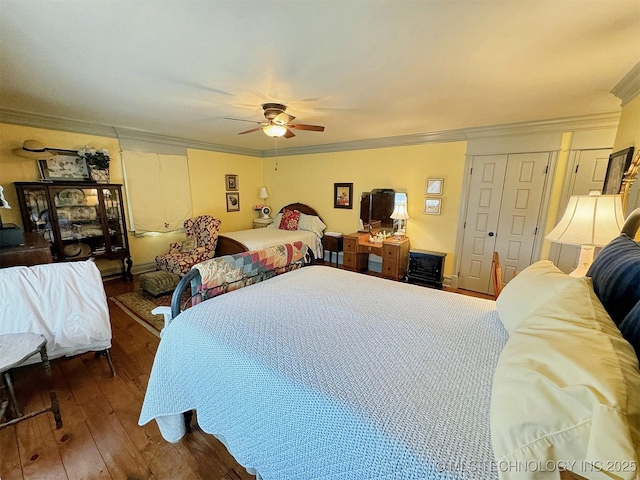 bedroom with ceiling fan, hardwood / wood-style flooring, and ornamental molding