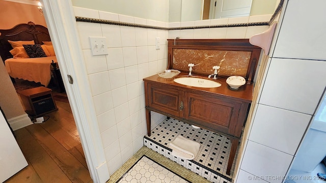 bathroom with vanity, tile patterned floors, and tile walls